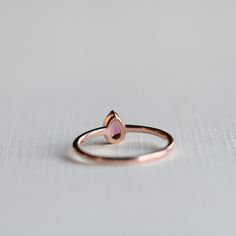 DESCRIPTION: >Tourmaline-adorned teardrop ring. >14k rose gold fully hallmarked. >Approx 1.4mm band width >3mm x 5mm tourmaline stone. FREE SHIPPING USA- All of our jewelry will arrive in custom packaging ready for gift giving. LEAD TIME: Made to order will take 10-14 days. Signature upon delivery, we unfortunately will not be able to reimburse or replace lost or stolen shipments. FOLLOW US ON: Instagram: @roseandchoc Facebook: /Roseandchoc Pinterest: @Roseandchoc Gold Pear Ring, Engagement Ring Teardrop, Ring Teardrop, Sterling Silver Opal Ring, October Birthstone Ring, October Birthstone Rings, Silver Opal Ring, Pear Ring, Teardrop Ring