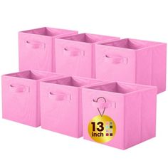 six pink storage bins with tags on the front and bottom, each in different sizes