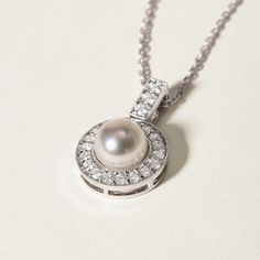 Experience Timeless Elegance with Akoya Pearls Material: Akoya Pearl, 18K white gold and diamond (S925 Silver Chain) Akoya pearl saltwater cultured pearl 1 pearl 6.5-7.0mm 21 diamonds about 0.315 carats in total Size of Pendant: 12.0*18.5 mm Handpicked of every pearl, only the top 1% of pearls are selected Handcrafted Lifetime warranty Classic White Gold Pearl Necklace As Gift, Luxury Pearl Diamond Necklace For Wedding, Classic Diamond Necklace With Pearl Chain For Formal Events, Pearl White Timeless Necklace For Anniversary, Akoya Pearl Round Necklace For Wedding, Round Akoya Pearl Necklace For Wedding, Diamond White Pearl Necklace For Anniversary, Round Akoya Pearl Necklaces For Wedding, Classic White Gold Pearl Necklace For Anniversary