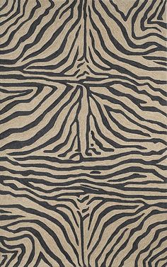 an animal print rug with black and white stripes