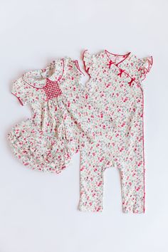 Made from the softest Pima cotton, this floral is perfect for a pop of color. Snap side closure for easy dressing. Bow details and picot trim details make this romper extra special. Floral Print Fitted Cotton Bubble Romper, Pink Floral Print Sleeveless Bubble Romper, Pink Floral Print Cotton Onesie, Playful Pink Floral Print Bubble Romper, Baby Girl Floral Romper, Blouse Jeans, Skirt Jumpsuit, Easy Dressing, Floral Romper