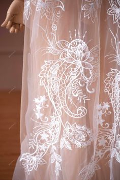 Delicate embroidery at wild totem pattern on illusion soft tulle, shimmery with sheer sequins. This Beautiful Wild Totem Embroidery Bridal Lace Online is perfect for wedding dresses and formal wears. shown color light ivory sold by the yard content polyester weight lightweight width 120cm washing instructions hand wash/drip dry White Embroidered Tulle Fabric For Ceremonies, White Sheer Lace For Party, White Tulle Fabric With Intricate Embroidery For Ceremony, White Organza Lace With Intricate Embroidery, White Organza Embroidered Fabric For Ceremony, Embroidered White Lace In Organza, Embroidered White Organza Lace, White Embroidered Organza Lace, White Tulle Wedding Dress With Floral Embroidery