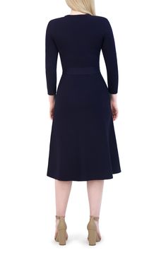 Simple and elegant, this evening-out A-line dress is designed with a defining satiny sash. Slips on over head Jewel neck Three-quarter sleeves Tie belt Unlined 65% rayon, 35% nylon Machine wash, dry flat Imported Fitted A-line Belted Dress For Party, A-line Belted Dress For Evening, Evening Dress With Half Sleeves, Solid Color Half Sleeve Evening Dress, Belted A-line Evening Dresses, Evening Dress Fitted 3/4 Length, Fitted Evening Dress 3/4 Length, Fitted Evening Dress With 3/4 Length, Elegant A-line Belted Dress For Party