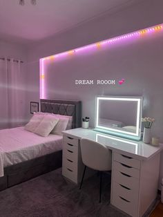 a bedroom with a bed, desk and mirror