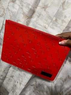 A Large Delta Sigma Theta clutch also can be worn as a wristlet.  Measures 12.5 inches x 9 inches. Handheld Red Clutch As A Gift, Red Pouch Clutch For Everyday Use, Trendy Red Clutch For Daily Use, Red Clutch Pouch For Gift, Red Envelope Travel Bag, Red Handheld Clutch With Removable Pouch, Red Clutch Pouch For Daily Use, Red Handheld Clutch For Travel, Red Travel Clutch With Removable Pouch