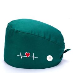 a green bean bag with a red heart and heartbeat on the side that says i love you