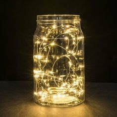 a mason jar filled with fairy lights