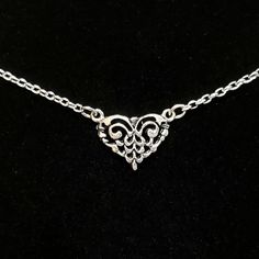 "- Gorgeous Filigree Connector Heart Pendant, or Necklace, in 925 Antique Sterling Silver Plated Pewter in Open-Cut design. See Photos #1-3. - Heart measures 5/8 x 3/4\". - Chain Length is 20\". - 925 Sterling Silver Filled Small Oval Rolo Chain. - Silver Plated EZ Toggle Clasp in Leaf motif for closure. See Photo #4. - We can customize the Clasp upon request at no cost. Choices include Lobster, Heart Toggle and Hook and Eye. Give us a Note on Etsy at Checkout with any change request. - Photos i Ornate Heart Charm Pendant Jewelry, Heart-shaped Oxidized Sterling Silver Necklaces, Classic Silver Necklace With Heart Charm, Heart-shaped Sterling Silver Necklace With Oxidized Finish, Heart Shaped Sterling Silver Necklace With Oxidized Finish, Silver Open Heart Engraved Charm Necklace, Silver Engraved Open Heart Charm Necklace, Silver Metal Charm Necklaces For Wedding, Dainty Silver Heart Pendant Jewelry