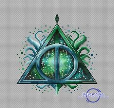 the deathly triangle cross stitch pattern is shown in blue, green and white colors