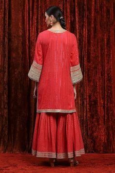 Watermelon red kurta with striped pattern base highlighted by gota, dori, badla and mirrorwork embroidered details. Comes with dot pattern sharara and checkered dupatta. - Aza Fashions Red V-neck Navratri Sets, Red V-neck Dress With Dupatta, Festive Designer V-neck Sharara, V-neck Sharara With Zari Work For Festivals, Red Bollywood V-neck Set, Red V-neck Bollywood Set, Traditional Red V-neck Kurta, Red V-neck Kurta With Resham Embroidery, Red V-neck Kurta For Festivals