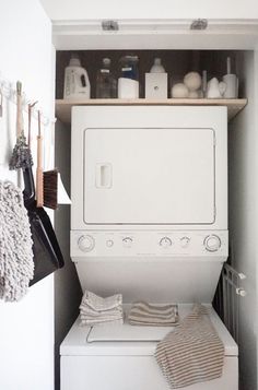 a white washer and dryer in a small room