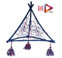 a small wooden structure with tassels and beads on it's sides, in front of a white background