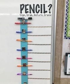 a bulletin board with pencils attached to it's sides and the words pencil?