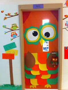 an owl door decorated with paper cut outs