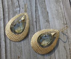 "A bohemian chic inspired handcrafted masterpiece in solid 18k Gold Large Hoop Earrings accented with Lemon Quartz. The earrings are hand carved giving way to a beautiful intricate texture, further accented with Lemon Quartz makes a timeless classic jewel. (e-124) Lemon Quartz(6.85cts) 11.5mm x 16.5mm Gold weight 15grams Drop length 2.5\" *Follow us @belesasjewelry on Instagram for promotions/giveaways *LIKE* us on Facebook http://www.facebook.com/Belesas *If you like the ring, please click on t Large Hoop Earrings, Lemon Quartz, Quartz Earrings, Bohemian Chic, Gold Hoop, Tear Drop, Unique Earrings, Timeless Classic, Earrings Handmade