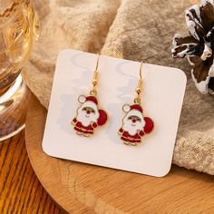 Product Category: Jewelry Introducing the perfect Christmas earrings set to complete your holiday look! Our Christmas Earrings Set features a variety of festive designs, from classic Christmas trees to adorable reindeers. Made with high-quality materials, these earrings are lightweight and comfortable to wear all day and night. Our set includes 9 pairs of earrings, so you'll have a different style for each day of the week. Each earring is adorned with sparkling rhinestones and vibrant colors, making them the perfect accessory for any Christmas party or event. These earrings make great gifts for friends and family, or just treat yourself to a little holiday cheer. Plus, they come in a beautiful gift box, ready to be wrapped and placed under the tree. Don't miss out on the holiday fun and ad Reindeer Ears, Classic Christmas Tree, The Perfect Christmas, Party Earrings, Christmas Earrings, Holiday Looks, Girls Jewelry, New Years Party, Beautiful Gift Boxes