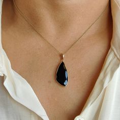 This stunning pendant is set in 14k Solid Yellow Gold with Natural Black Onyx with utmost precision. It is an unique gemstone pendant for nearly every occasion and is completely hassle-free jewelry. 🔷ABOUT GEMSTONE:  Black onyx is often considered a protective stone. It is believed to absorb and transform negative energies, preventing them from affecting the wearer. Black onyx is associated with strength, both physical and emotional. It is believed to provide inner strength, resilience, and sta Black Faceted Jewelry As A Gift, Black Faceted Jewelry For Gift, Black Onyx Jewelry With Large Stone, Black 14k Gold Pendant Jewelry, Onyx Jewelry With Large Pendant As Gift, Onyx Large Pendant Jewelry As Gift, Elegant Onyx Jewelry With Large Pendant, Black Teardrop Pendant Jewelry As A Gift, Black Teardrop Pendant Jewelry Gift