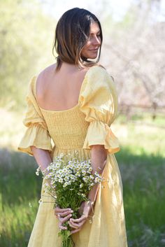 Style // Think cool, stylish, effortlessly beautiful. A subtle, soothing and summer infusing yellow linen! Dreamy in every sense of the word For your wearing pleasure. The Deia Dress is a midi to long length dress with a slightly scooped neckline and tiered skirt. It features an elastic bodice to fit perfectly to any shape, and puffed sleeves for a more romantic vibe. The dress has some structure while leaving plenty of room for comfort and of course, style. Made from super-soft linen, and desig Elegant Yellow Midi Dress With Square Neck, Elegant Yellow Square Neck Midi Dress, Summer Midi Dress With Smocked Back And Square Neck, Linen Square Neck Midi Dress For Garden Party, Square Neck Linen Midi Dress For Garden Party, Square Neck Linen Midi Dress With Smocked Back, Summer Midi Dress With Square Neck And Ruched Detail, Spring Linen Midi Dress With Square Neck, Linen Ruched Midi Dress For Brunch