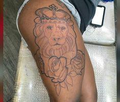 a man with a lion tattoo on his arm