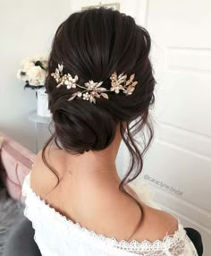 a woman wearing a hair comb with flowers on it