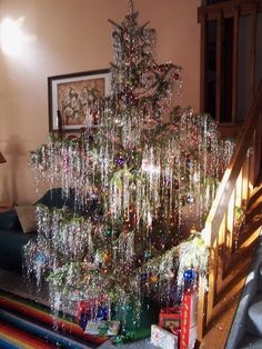 a christmas tree is covered with icing in the living room