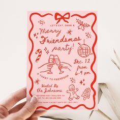 a hand holding up a pink card with red writing on the front and bottom that says merry christmas party