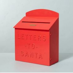 a red mailbox with the words letters to santa written on it