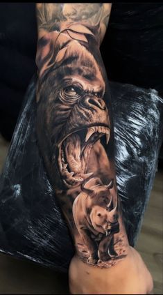 a person with a tattoo on their arm and an image of a gorilla attacking another animal