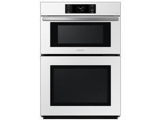 two white ovens side by side on a white background