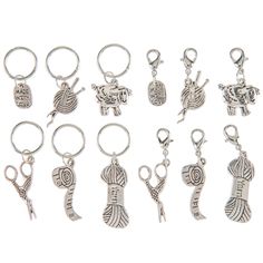 a set of twelve keychains with different designs on them, all in various shapes and sizes