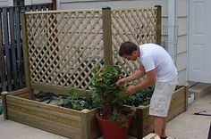 Fix Fabulous: Earth Box Garden---wonderful idea to hide ugly Earthboxes Earthbox Gardening, Wooden Planters With Trellis, Box Garden, Outdoor Living Design, Garden Veggies, Backyard Paradise, Patio Landscaping, Small Outdoor Spaces, Backyard Living