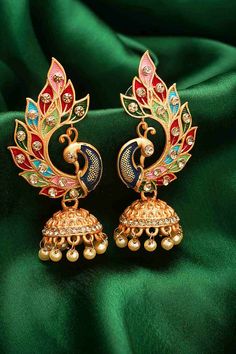 Product Features:   Color: Gold and Multi Color Material: Alloy Product Weight: 75 Gram Occasion: Party Wear Disclaimer: There will be slight difference in digital to actual image Luxury Multicolor Festive Jhumkas, Luxury Multicolor Jhumkas For Celebration, Festive Party Danglers For Pierced Ears, Bollywood Style Peacock Design Earrings For Party, Bollywood Style Peacock Earrings For Party, Bollywood Style Peacock Design Party Earrings, Bollywood Party Earrings With Peacock Design, Elegant Multicolor Peacock Design Jhumkas, Festive Peacock Design Party Earrings