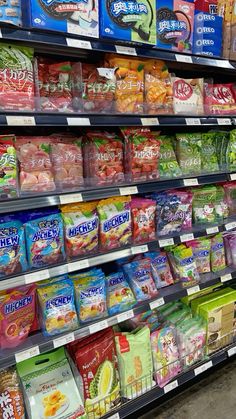 a display in a grocery store filled with lots of different types of snacks and drinks