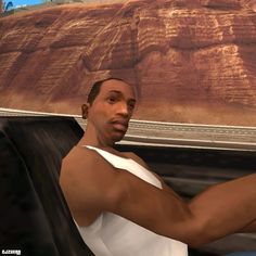 a man driving a car in the middle of an animated desert area with mountains and sand behind him