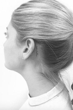 a woman's profile with the caption tiny behind - the - ear tattoo ideas