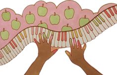 two hands are holding an apple shaped paper plate with piano keys and apples on it