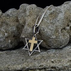 "Since ancient times, humans have known about the protective properties of these most ancient and mysterious symbols from the history of mankind. It is believed that the magic code encrypted in the Star of David brings luck, health and protection to its owner, and the cross endows it with Divine grace and faith in Salvation from evil and negative energies. Typically, these amulets were worn by Christians and Messianic believers, and today their owners are united by a deep respect and connection Sterling Silver Star Of David Amulet Necklace, Spiritual Yellow Gold Cross Necklace, Spiritual Hallmarked Crucifix Necklace, Spiritual Sterling Silver Cross Necklace, Sterling Silver Amulet Necklace With Cross Pendant, Engraved Cross Necklace For Blessing, Spiritual Pendant Cross Necklace, Sterling Silver Amulet Necklace In Cross Shape, Spiritual Cross Pendant Necklace With Box Chain