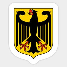 the german coat of arms sticker is black and yellow with red ribbons on it