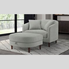 a living room scene with focus on the chair and ottoman