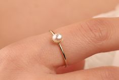 Our dainty pearl ring is 14k solid gold and its available in rose gold and gold. At the top, it has a charming pearl, that accompany you at any time of the day. It is the perfect gift for your partner on special days. Also, it can be used as a wedding ring or bridesmaid ring. Moreover, if you think this dainty pearl ring as a gift, it makes happy your loved ones on their birthdays, mother's day, valentine's day, anniversary, or graduation. If you want, you can add a gift note for your loved ones Minimalist Rose Gold Pearl Ring, Delicate Simple Design Pearl Ring For Anniversary, 14k Gold Dainty Pearl Ring For Formal Occasions, Dainty 14k Gold Pearl Ring For Formal Occasions, Delicate 14k Gold Pearl Promise Ring, Delicate Pearl Ring With Simple Design, Dainty Rose Gold Pearl Ring For Formal Occasions, Simple Pearl Ring For Wedding, Minimalist Rose Gold Pearl Ring Gift