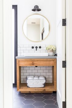 a bathroom with a sink and mirror in it