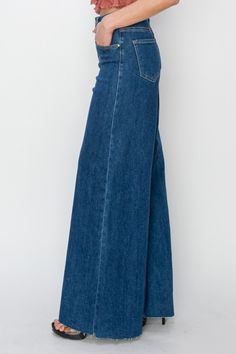 High rise palazzo jeans offer a unique and fashion-forward take on denim with their wide-legged silhouette and high-waisted fit. These jeans provide a modern twist on the classic palazzo pants style, combining comfort and elegance for a versatile wardrobe piece. The high rise waistline accentuates the waist and elongates the legs, creating a flattering and elongated look. Perfect for creating a chic and sophisticated outfit, these jeans can be styled with a variety of tops for different occasions. Whether dressed up with heels or worn casually with sneakers, high rise palazzo jeans are a stylish and versatile choice for adding a statement to your ensemble. Elevate your denim game with the high rise palazzo jeans to showcase your fashion-forward style and unique flair. Features: Raw Hem, Po Jumpsuit Dress