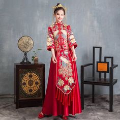 Looking a traditional Chinese bridal gown. This beautiful 2-piece qun kwa set is embroidered with gold, silver,blue and white threads. The intricate flower and peacock embroideries are decorated throughout the jacket and skirt. The peacock is a manifestation of the heavenly phoenix on earth, divinity, beauty, power, rank, and beauty. It's a perfect option for your traditional Chinese wedding, tea ceremony. Size Guide: Please refer to the size guide picture before placing the order. Please leave Traditional Wedding Gown With Traditional Patterns, Traditional Ceremony Gown For Festivals, Ceremonial Embroidered Dress With Traditional Drape, Traditional Embroidered Dress For Wedding With Traditional Patterns, Traditional Floor-length Gown For Ceremonies, Traditional Embroidered Dress With Traditional Patterns For Wedding, Traditional Embroidered Dress With Patterns For Wedding, Traditional Festive Cheongsam For Ceremony, Ceremonial Gown With Traditional Patterns And Drape