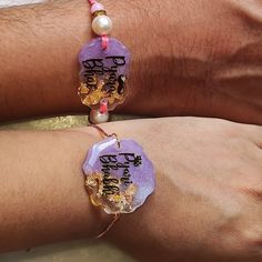 These handmade Resin Rakhi is perfect for your stylish brother and sister in law! Its shiny glossy resin and beautiful designs will make it a unique addition to the Raksha Bandhan celebrations. Make this Raksha Bandhan special with this stylish Resin Rakhi. Handmade Shiny Crystal Clear Resin  Sentiments written in gold foil Attractive ready to gift card packaging Handmade Bracelets As Diwali Gifts, Pink Handmade Bracelet For Diwali, Handmade Pink Bracelet For Diwali, Handmade Pink Bracelets For Diwali, Adjustable Bracelets For Diwali Gift, Spiritual Festive Gift Bracelets, Spiritual Bracelets For Festive Gift, Spiritual Bracelets As Festive Gifts, Traditional Pink Bracelets For Gifts