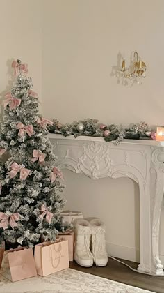 a decorated christmas tree in front of a fireplace