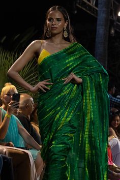 Upgrade your ethnic elegance with our Gia Green & Yellow Tie Dye Georgette Silk One Minute Saree. Crafted from luxurious raw silk, this stunning saree features a mesmerizing green-yellow tie-dye pattern. The pallu is adorned with vibrant yellow tassels, while the matching blouse comes with delicate spaghetti straps in yellow raw silk, adding a touch of sophistication to your traditional attire. Suitable for a summer night out, wedding party, pooja or any other function! About this Product Saree: Orange Hijab, One Minute Saree, Raw Silk Blouse, Yellow Tie Dye, Raw Silk Saree, Yellow Tie, Natural Dyeing, Yellow Saree, Organza Sarees