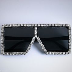 Another stunning version of our Como shades! How nice are these? Complete with crystal/rhinestone embellishments for the ultimate bling! They'll have you standing out from the crowd for all the right reasons! Style: Square with crystal embellished frame. Lens Height: 6.5 cm Lens Width: 6.8 cm UV400 Protection Trendy Rhinestone Crystal Sunglasses, Trendy Crystal Sunglasses With Rhinestones, Party Gold Sunglasses With Rhinestones, Party Crystal Sunglasses With Rhinestones, Party Sunglasses With Rhinestones And Crystal Material, Silver Sunglasses With Rhinestones, Silver Rhinestone Sunglasses With Glass, Silver Rhinestone Sunglasses With Glass Lenses, Adjustable Clear Sunglasses For Parties