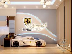 a white toy car sitting on top of a hard wood floor next to a wall