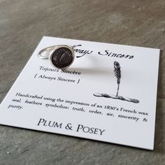 Feather Stacking Ring Tojours Sincère {Always Sincere} Handcrafted from the impression of an 1830's French wax seal, feathers symbolize: truth, order, air, sincerity & purity. Materials: Sterling Silver Seal Size: Approx 1/2 inch {12 - 13 mm}  Ring Band Width: 1.4mm (Skinny Band) Ring Size: Choose from drop down menu Each Plum and Posey wax seal design arrives accompanied by it's own meaning card, and tucked into an elegant jewelry bag ready for gift giving. Matching Feather pieces: https://www.etsy.com/ca/shop/PlumAndPoseyInc?ref=seller-platform-mcnav&search_query=328 More Plum & Posey rings: https://www.etsy.com/ca/shop/PlumAndPoseyInc?ref=seller-platform-mcnav&section_id=19551663  Rings, jewelry other than the item listed above, and all props in the photo (antique boxes etc) are not par Wax Seal Design, Posey Ring, Wax Seal Ring, Seal Ring, Seal Design, Antique Boxes, Jewelry Bag, Wax Seal, Wax Seals