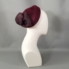 Raleigh | Custom | Millinery | Felt | Merlot | Calot | Bow – Lifted Millinery Formal Fascinator With Satin Bow, Chic Winter Fascinator For Formal Occasions, Chic Winter Formal Fascinator, Elegant Formal Fascinator With Satin Bow, Elegant Fitted Brown Headpiece, Elegant Purple Headpieces For Formal Events, Elegant Purple Headpieces For Formal Occasions, Elegant Formal Headpiece With Bow, Elegant Fitted Brown Fascinator